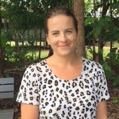 photo of Leah, a happy trailer owner with trees in the background